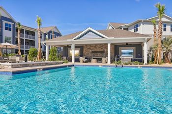 Swimming pool with covered pavilion and fireplace